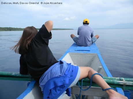writer and photographer Jojie Alcantara documenting a pod in Dahican waters